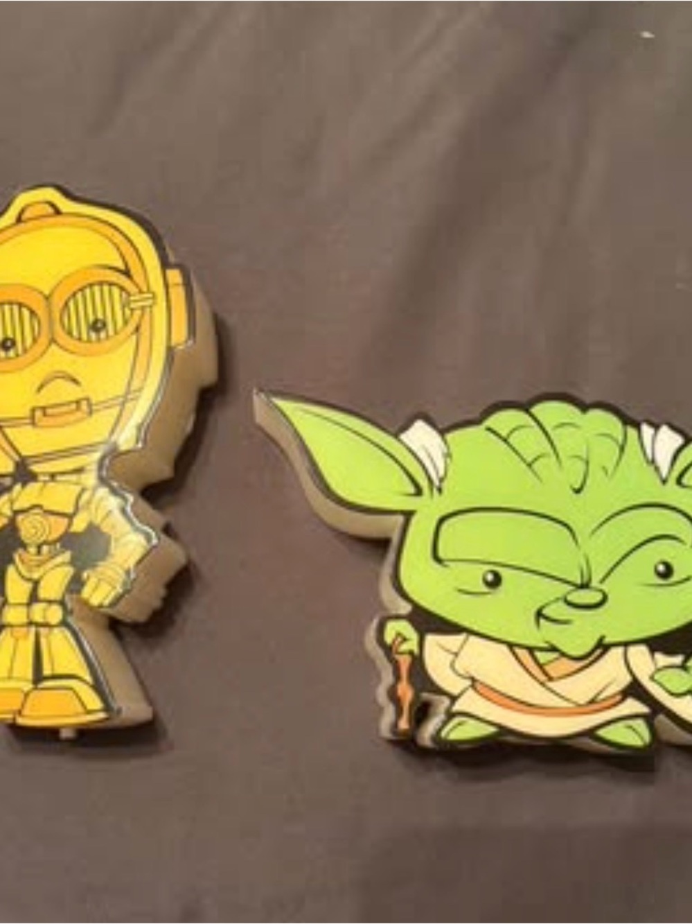 Set up of 2 wall hanging light up Star Wars yoda & C3PO figures